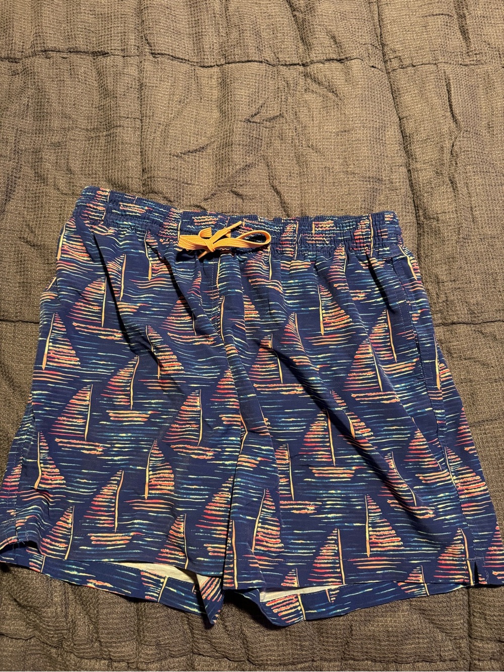 chubbies Navy Sailboat Swim Trunks with Yellow Drawstring